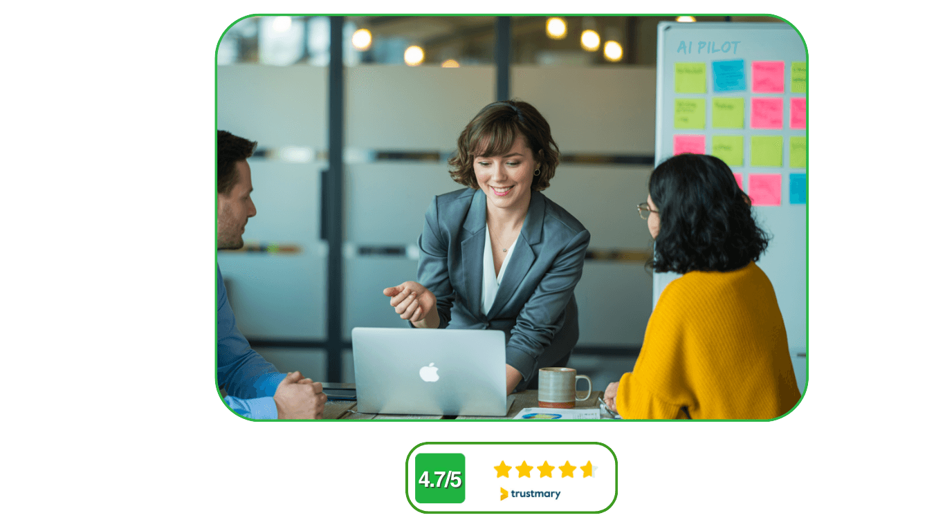 Three diverse professionals collaborating around a conference table with a woman leading a strategy discussion, an 'AI PILOT' whiteboard in the background